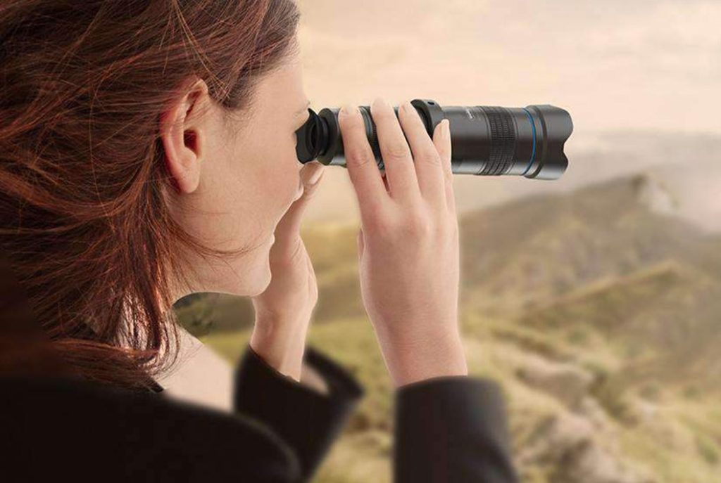 lady using a monocular for bird watching