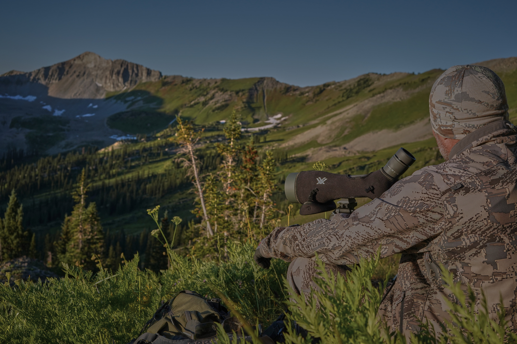 scouting for animals on top of a mountain