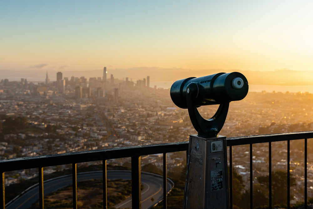 a coin-operated steel tool used for viewing the entire city proper