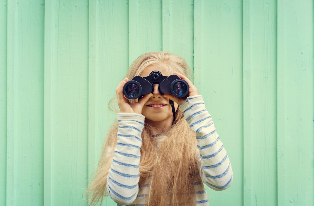 a little girl who is looking for something