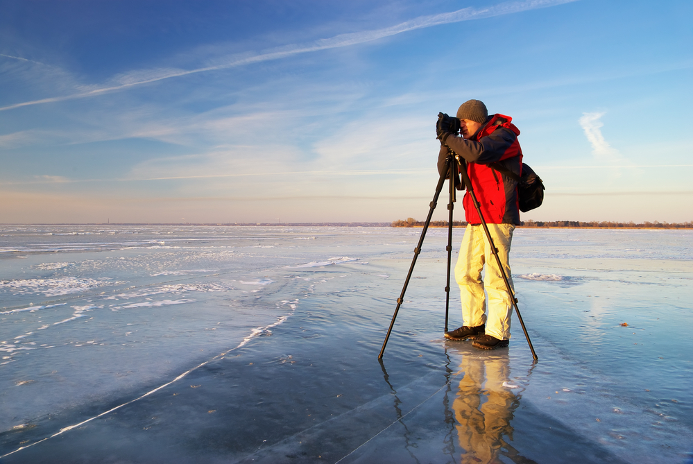 Photographer using a tripod